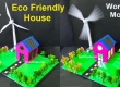 DIY eco-friendly house model with solar panels and a wind turbine, displayed on a green base with plants, showcasing a working model of renewable energy for school or home projects." Let me know if you'd like a shorter version for social media or a version tailored for Pinterest pin descriptions or WordPress featured images.